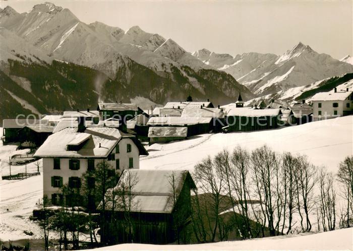 Villa GR Dorfansicht mit Piz Ault und Piz Terri Winterlandschaft Alpen
