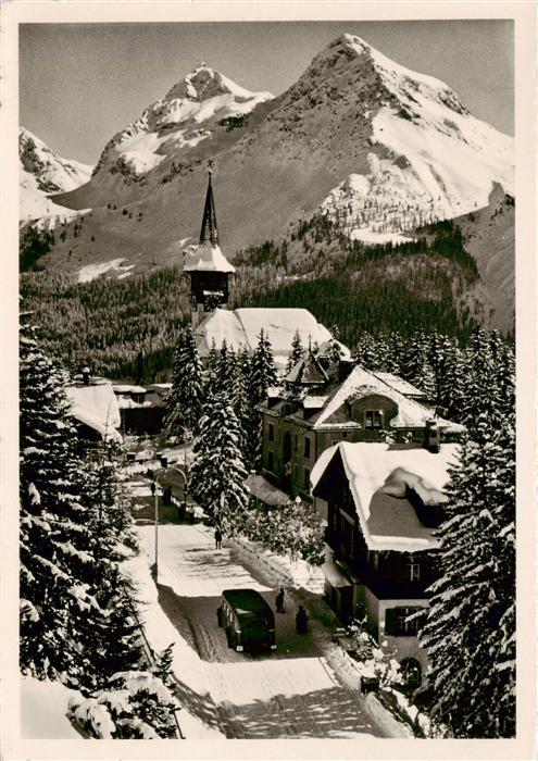 Arosa GR Dorfkirche Blick auf Furkahoerner Winter in den Alpen