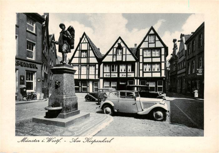 Muenster  Westfalen Am Kiepenkerl Brunnen Statue Fachwerkhaeuser Altstadt Automo