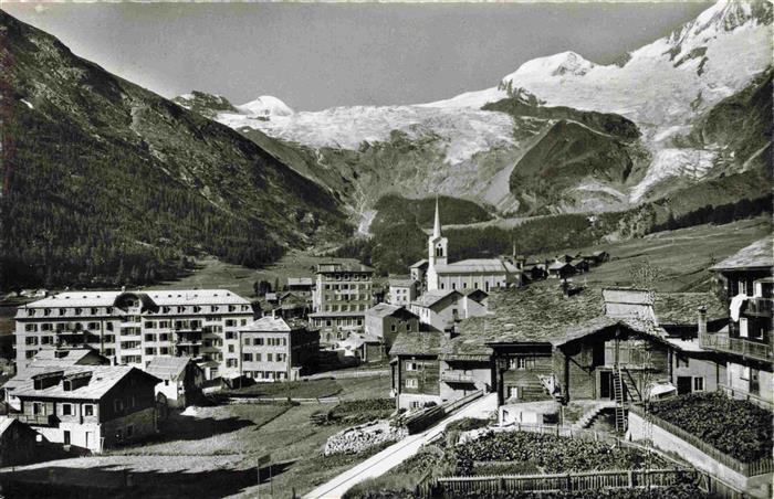 Saas-Fee VS Ortsansicht mit Kirche Fee-Gletscher Allalinhorn und Alphubel Wallis