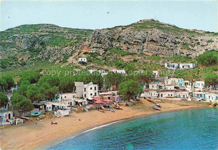 Matala Kreta Crete Greece Strand Bucht Boote Felsenhoehlen Baeume Dorf Luftaufna