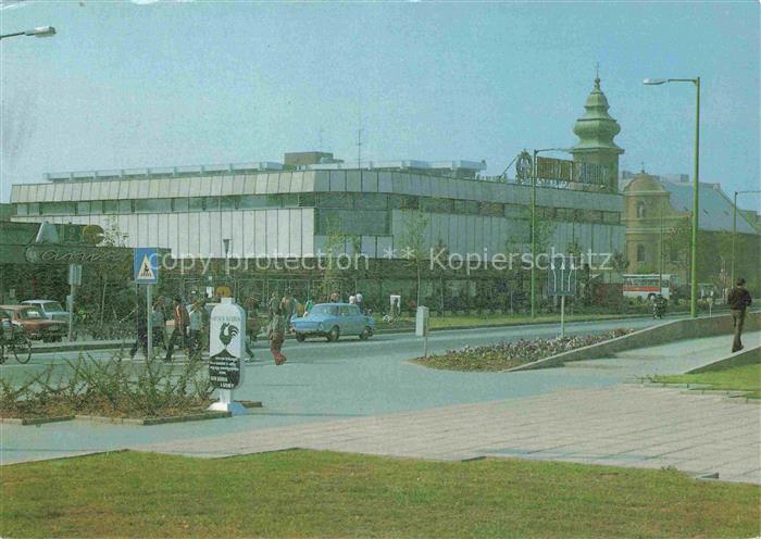 Ajka Veszprem Megye HU Horizont-Áruház Warenhaus Strassenszene Kirchturm Auto Fu