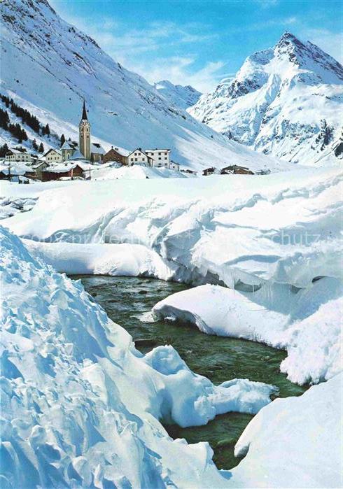 Galtuer Landeck Tirol AT Paznauntal Bach Kirchturm Winterlandschaft Bergdorf Ber