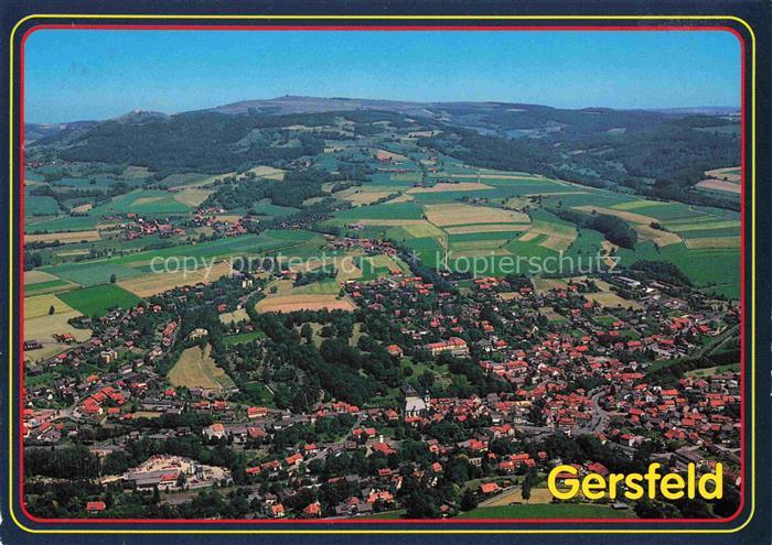 Gersfeld Rhoen Kneipp-Luftkurort Rhoen Fliegeraufnahme Huegel Wohngebiet Felder