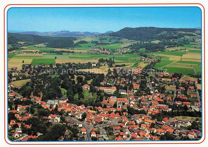 Gersfeld Rhoen Kneipp-Luftkurort Rhoen Fliegeraufnahme Kirche Huegel Wohngebiet