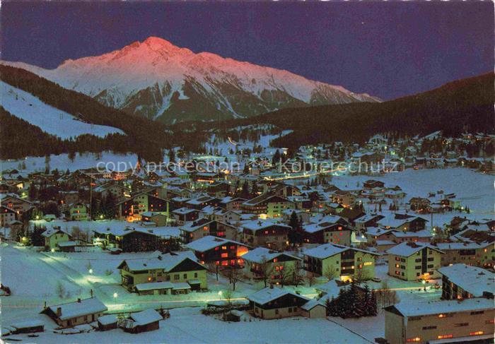 SEEFELD Tirol AT Nachtaufnahme Abendrot Alpengluehen Beleuchtung Schnee Bergdorf