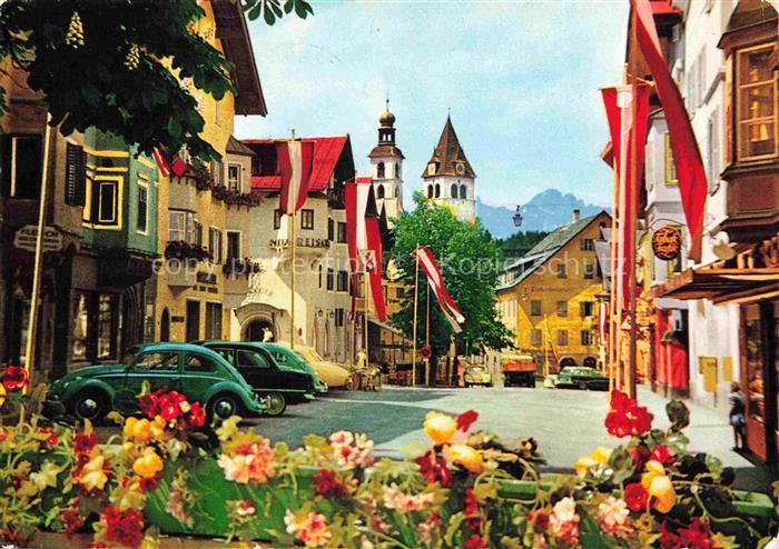 Fieberbrunn Kitzbuehel Tirol AT Hauptstrasse Kirche Zwiebelturm Stadtplatz Blume