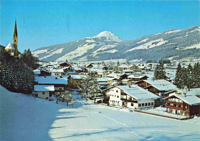 Kirchberg Tirol AT Hohe-Salve Kirchturm Bergpanorama Ortschaft Winterlandschaft