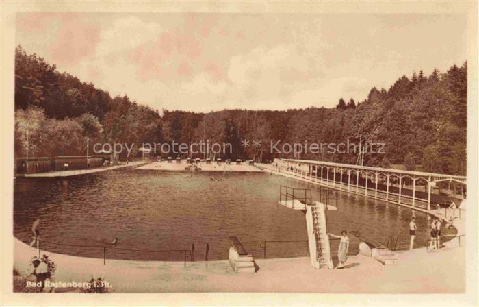 Bad Rastenberg Freibad Schwimmbad Badegaeste Steg Sprungturm Wald Ufer Liegewies