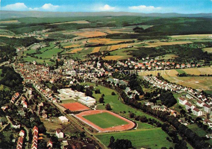 Weilmuenster Hessen Fliegeraufnahme Taunus Sportplatz Stadion Schule Wohnhaeuser