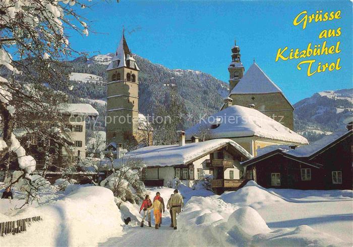Kitzbuehel Tirol AT Kirchturm Schnee Winterlandschaft Kirche Spaziergaenger Berg