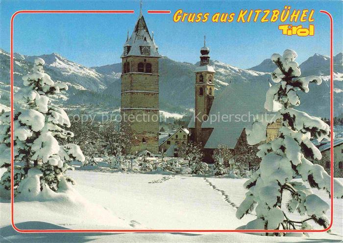 Kitzbuehel Tirol AT Kirchturm Schnee Winterlandschaft Berge Tannen Kirche