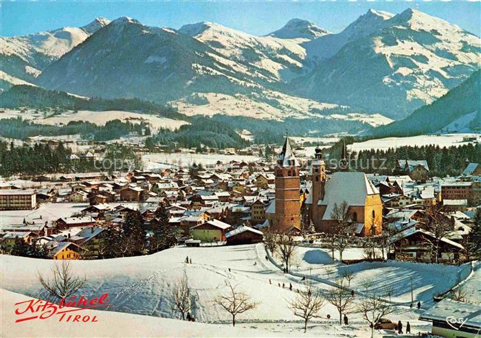 Kitzbuehel Tirol AT Kitzbueheler-Alpen Winterpanorama Kirchturm Schnee Ortschaft
