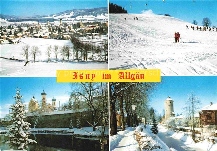 Isny Allgaeu Bayern Winteransicht Skifahrer Kirche Stadtturm Schnee Stadtpanoram