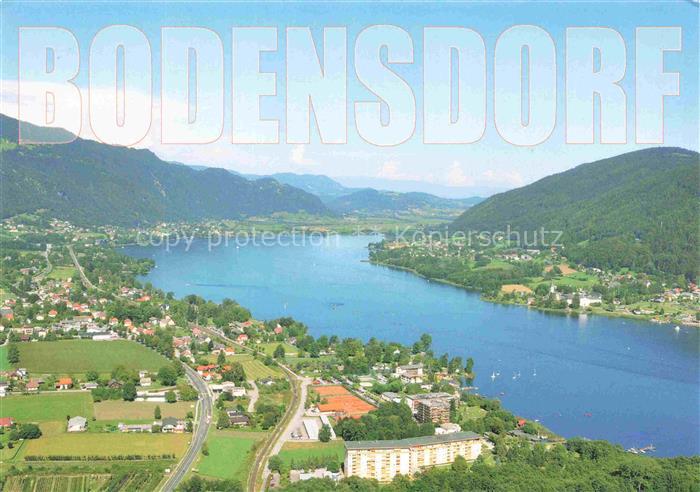 Bodensdorf Ossiacher See Kaernten AT Ossiacher-See Luftaufnahme See Berge Ortsch