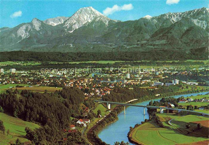 VILLACH Kaernten AT Mittagskogel Drau Bruecke Fliegeraufnahme Stadtpanorama Berg