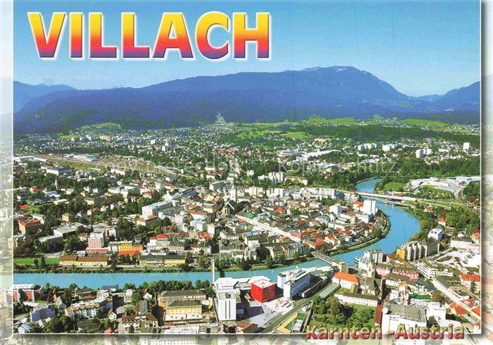 VILLACH Kaernten AT Drau Fliegeraufnahme Stadtpanorama Berge Fluss Kirche Altsta