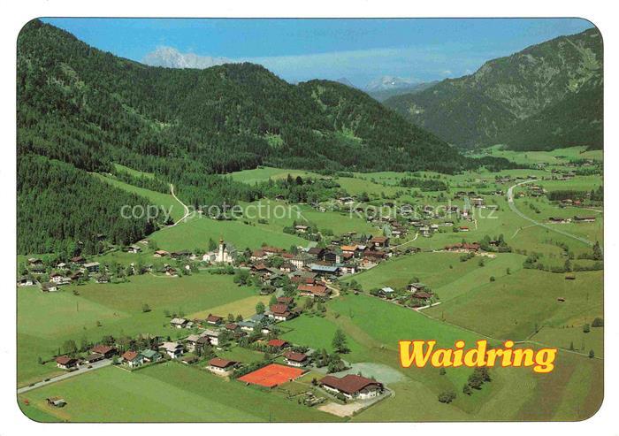Waidring Tirol AT Fliegeraufnahme Dorfansicht Alpental Kirche Tennisplatz Bergwa