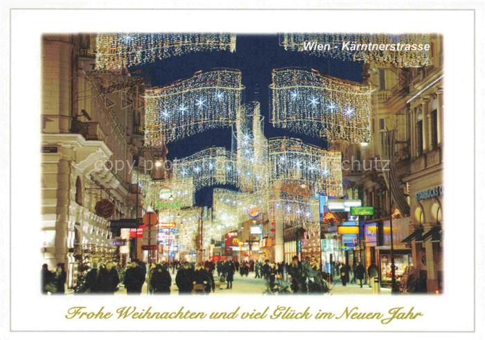 WIEN AT Kaerntnerstrasse Weihnachtsbeleuchtung Fussgaengerzone Passanten Nacht W