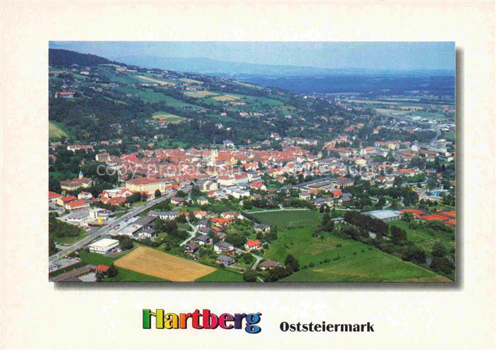 Hartberg Steiermark AT Stadtansicht Kirche Haeuser Felder Huegel Wald Strasse