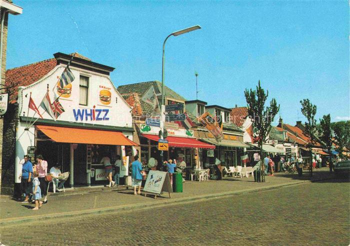 Renesse aan Zee Zeeland NL Lange-Reke Einkaufsstrasse Whizz Geschaefte Kopfstein
