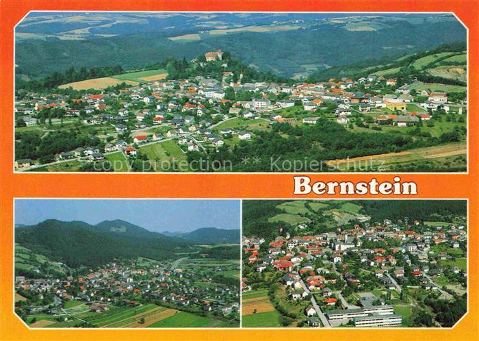 Bernstein Burgenland AT Ortsansicht Burg Huegel Felder Luftbild Wohnhaeuser Tal