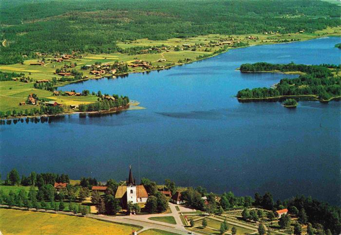 Dalarna Sweden Svaerdsjon och Svardsjoe kyrka oesterbyn i bakgrunden Flygfoto
