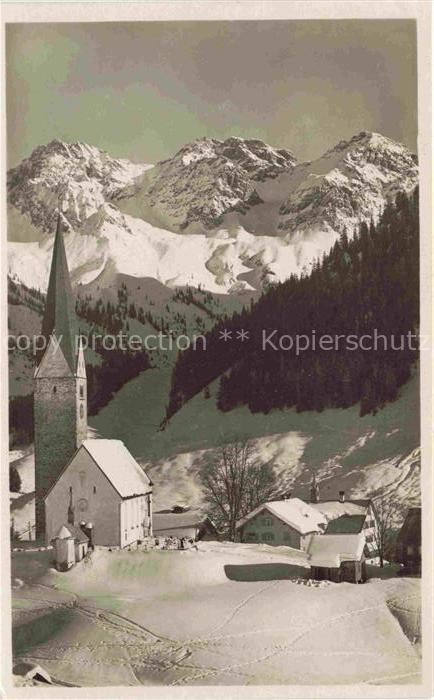 Mittelberg Oy Allgaeu Winterpanorama Ortsansicht mit Kirche Blick gegen Schafalp