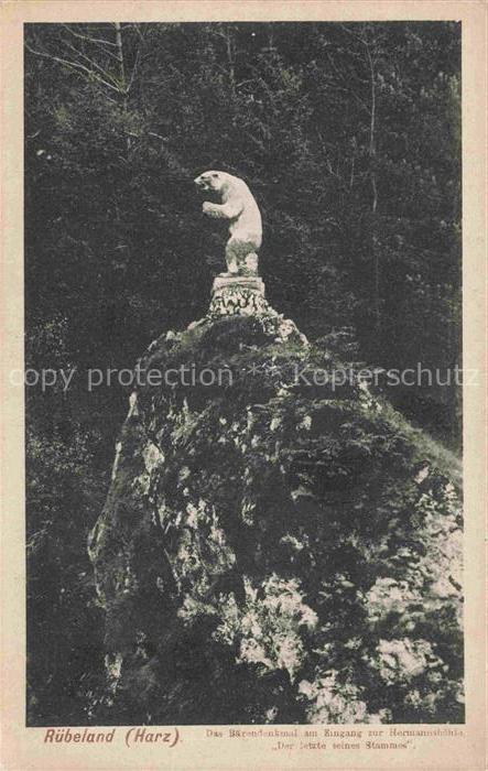 Ruebeland Elbingerode Harz Baerendenkmal am Eingang zur Hermannshoehle