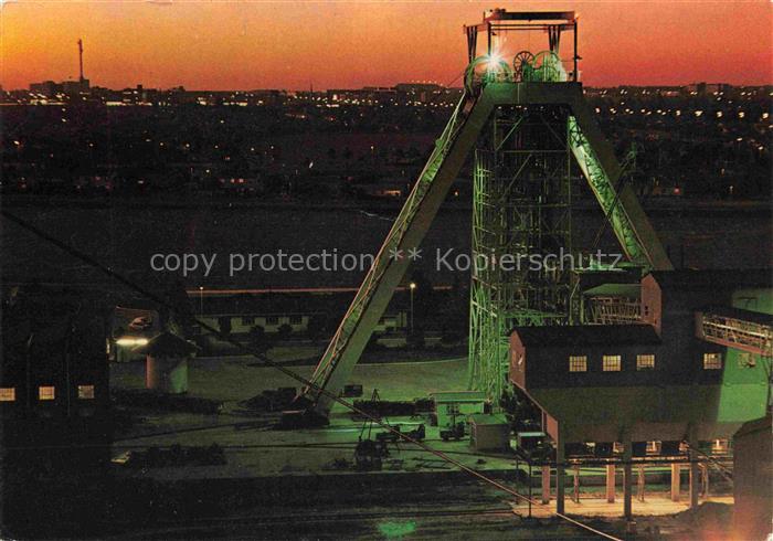 Suedafrika Southafrica RSA Mining Gold Mine at night showing typical headgear