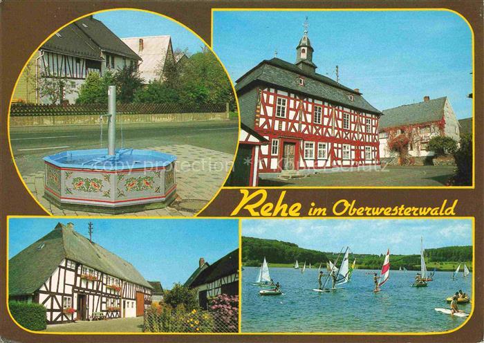 Rehe Westerwald Rheinland-Pfalz Brunnen Fachwerkhaeuser Seepartie