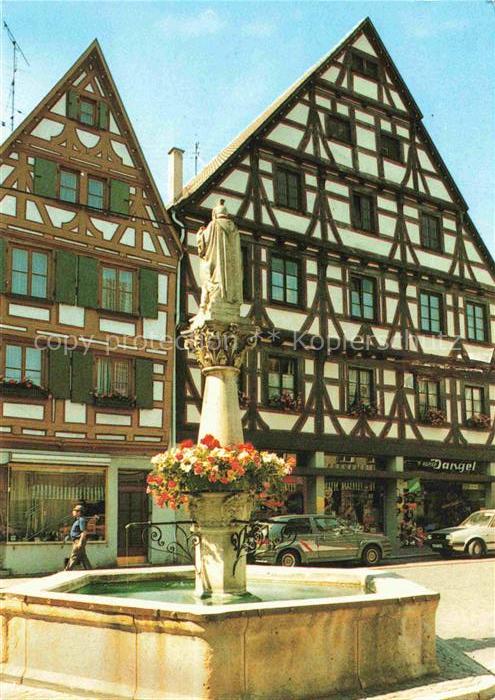 Munderkingen Motiv Stadtzentrum Martinstrasse Brunnen Fachwerkhaeuser