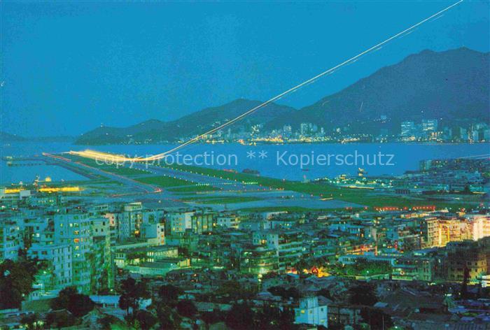 Kowloon Hong-Kong China Kai Tak Airport at night with its extended modern runway