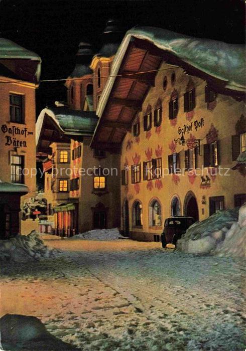 St Johann Tirol AT Ortszentrum im Winter bei Nacht Gasthoefe