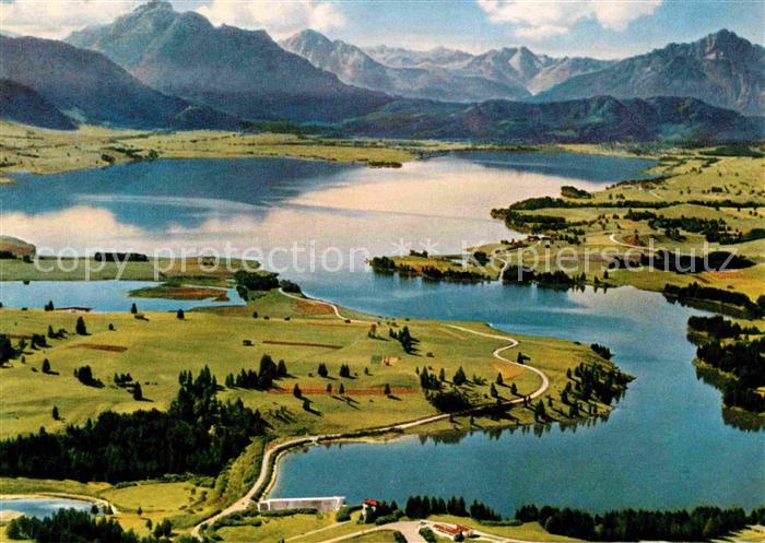 Forggensee Schwangau mit Staudamm Saeuling Tiroler Hochgebirge Fliegeraufnahme