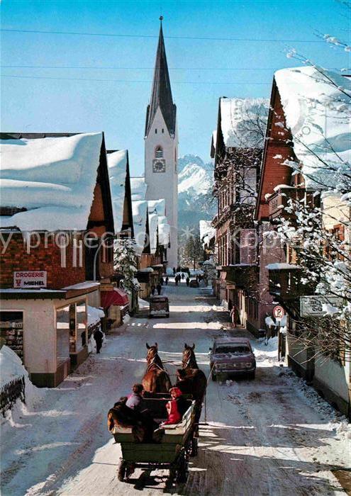 Oberstdorf Kirchstrasse im Winter mit Pferdewagen