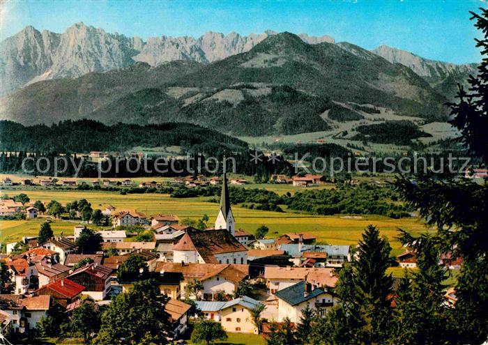 Koessen Tirol Ortsansicht mit Kirche Blick gegen Kaisergebirge