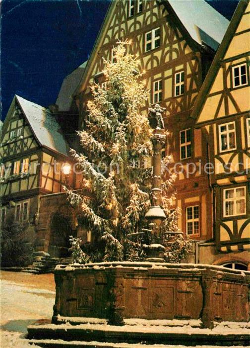 Miltenberg Main Marktplatz zur Weihnachtszeit Christbaum Fachwerkhaeuser