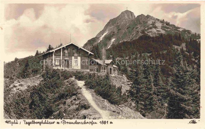 Fuessen am Lech Allgaeu Bayern Tegelberghaeuser mit Branderschrofen Allgaeuer Al