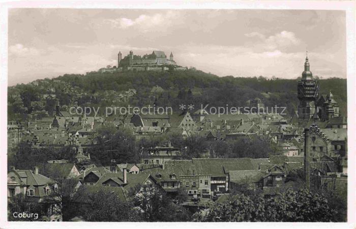 Coburg Bayern Veste-Coburg Stadtpanorama Burg Daecher Kirchturm Baeume Haenger