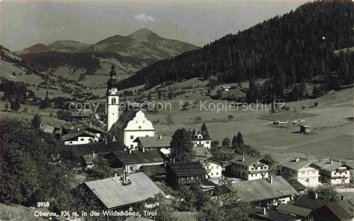 Oberau Tirol Wildschoenau Tirol AT Wildschoenau Kirchturm Dorfansicht Bergpanora