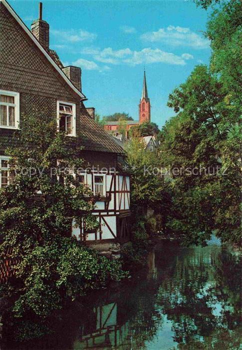 Bad Berleburg NRW Odeborn Fachwerkhaus Kirchturm Baeume Spiegelung Bach Kneipp-H