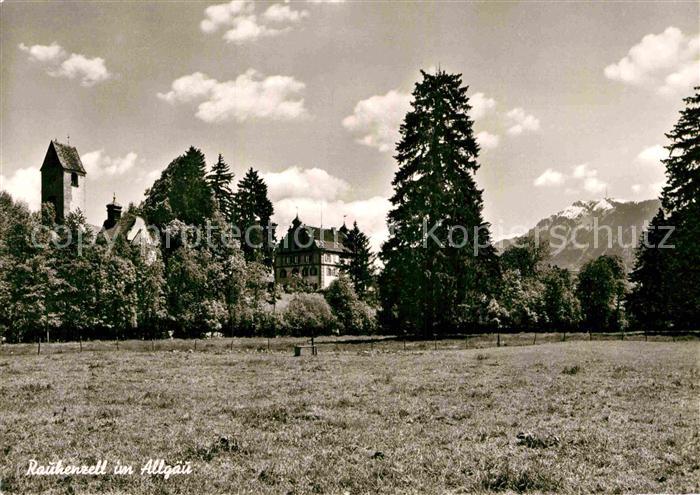 Rauhenzell Blick ueber die Wiesen Kirchturm Alpen
