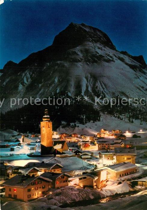 Lech Vorarlberg Ortsansicht mit Kirche bei Nacht Blick gegen Omeshorn