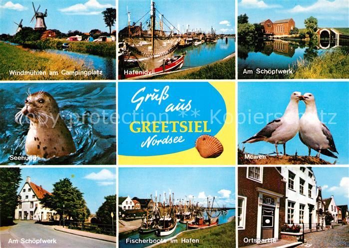 Greetsiel Windmuehlen Hafenidyll Schoepfwerk Seehund Moewen Fischerboote im Hafe