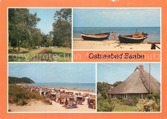 Baabe Ostseebad Ruegen Kurpark Boote am Strand Rohrdachhaus