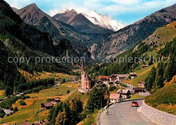 Heiligenblut Kaernten Ortsansicht mit Kirche Blick zum Grossglockner Hohe Tauern