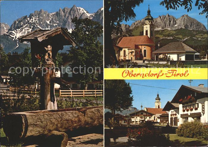 Oberndorf Tirol Wegekreuz Brunnentraenke Kirche Dorfpartie Wilder Kaiser