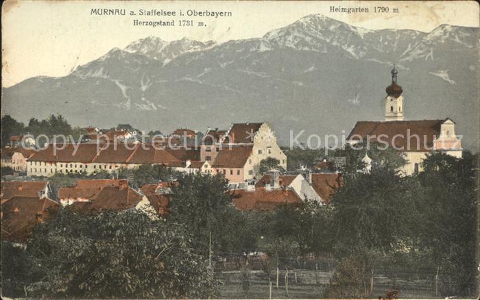 Murnau Staffelsee Ortsansicht mit Kirche Herzogstand Heimgarten Alpen