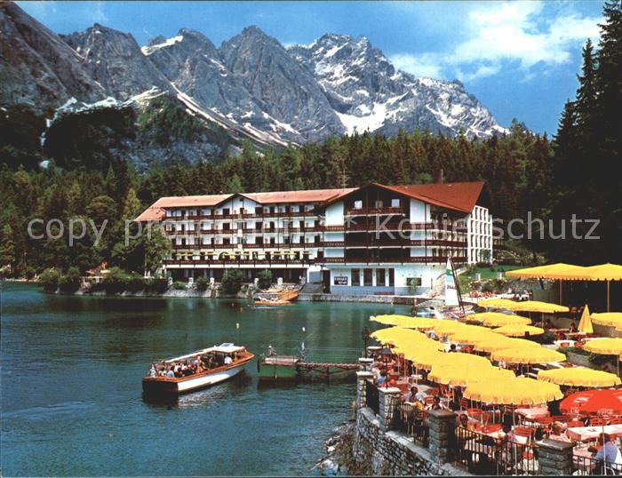 Eibsee Eibseehotel und Eibseepavillon Terrasse mit Boot Anlegestelle und Zugspit